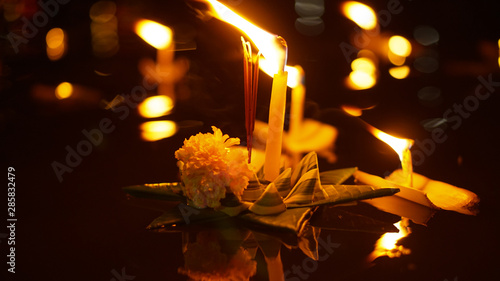 Floating loy krathong and candle in Thailand full moon folk festival photo