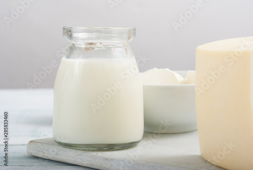 dairy products on old white wooden table