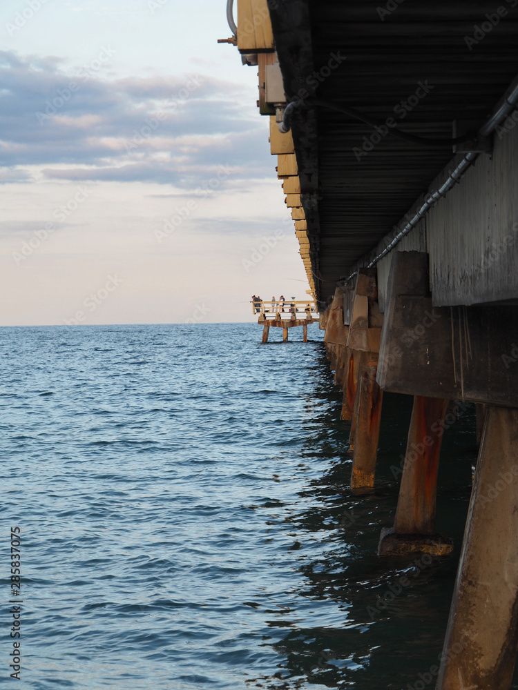 turquoise water under pier at the beach in Lauderdale Florida, tropical paradise