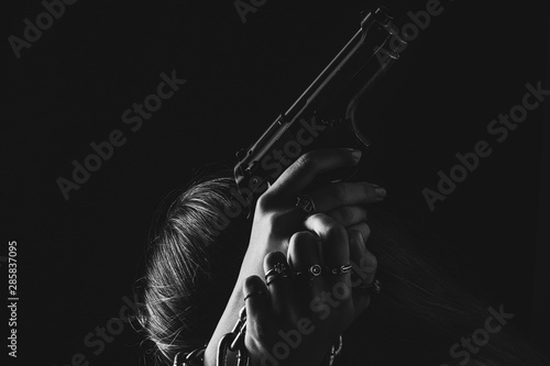 The woman is distraught with a gun