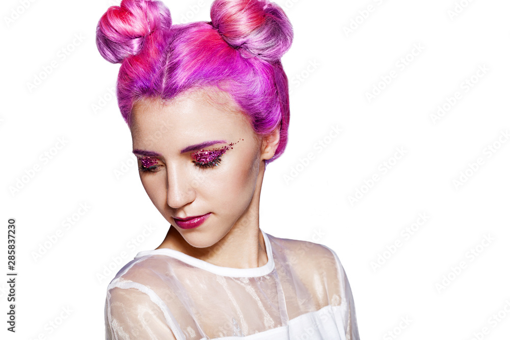 A girl in a white dress with colored hair and a festive creative make-up of bright pink sparkles. Isolated on white background