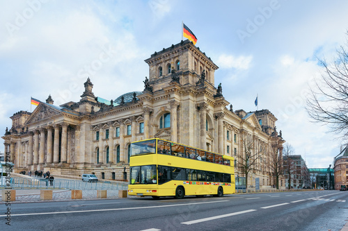 Photography Yellow Touristic shuttle bus at Reichstag building in Berlin