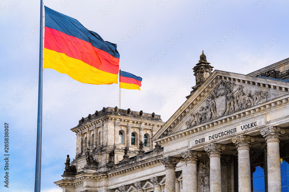 Reichstag building architecture and German Flags at Berlin