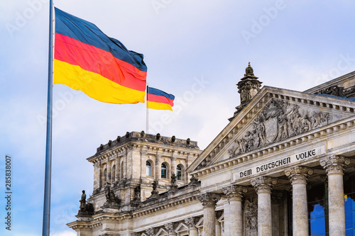 Reichstag building architecture and German Flags at Berlin photo