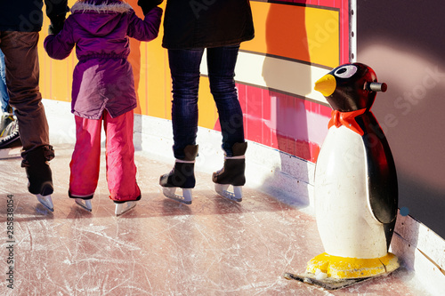 Photography Penguin skate aids and assistant and family doing skating Berlin
