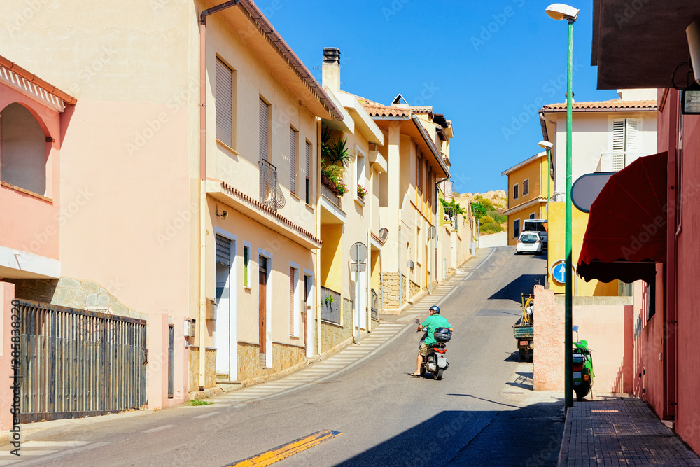 Street view with Scooter on Road in town in Cagliari