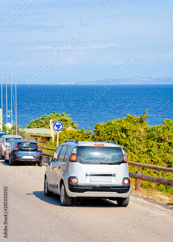 Car driving at highway road Capo Testa