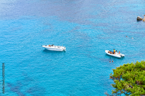 Boats in blue Mediterranian Sea in Capo Testa © Roman Babakin