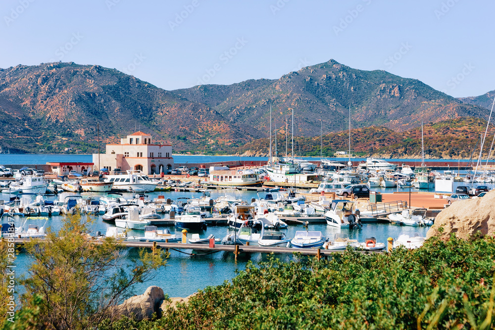 Old Sardinian Port with ships near Mediterranean Sea in Villasimius