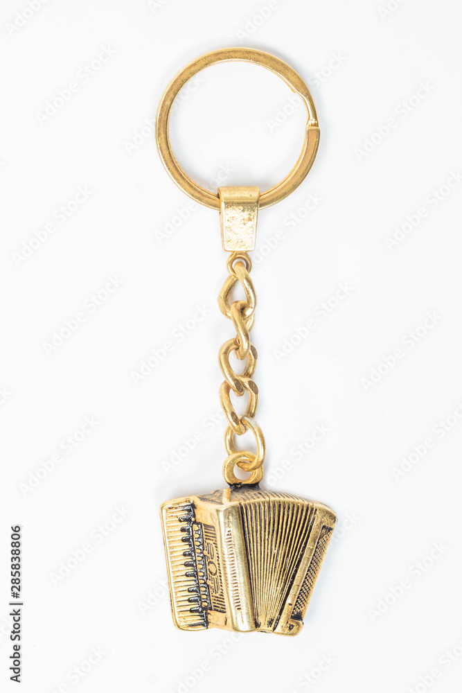 llavero de acordeon de oro o bronce de colombia foto de Stock | Adobe Stock