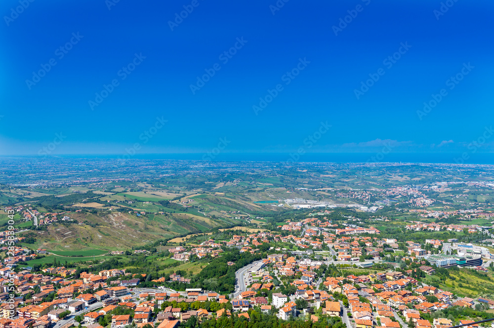 San Marino cityscape. View on San Marino city from observation deck. Yellow roofs of San Marino town San Marino cityscape. View on San Marino city from observation deck. Yellow roofs of San Marino town