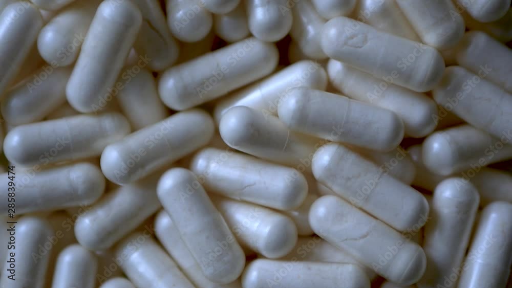 Close-up of A Rotating Heap of Capsules, Pharmacy Background With Selected Focus Close-up of A Rotating Heap of Capsules, Pharmacy Background With Selected Focus