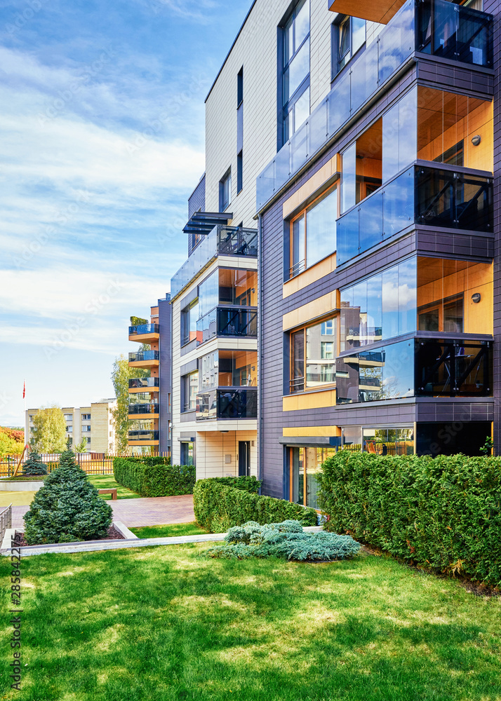 Modern residential buildings with green trees