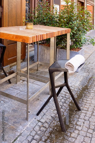 Table and chair at street cafe or restaurant in Graz photo