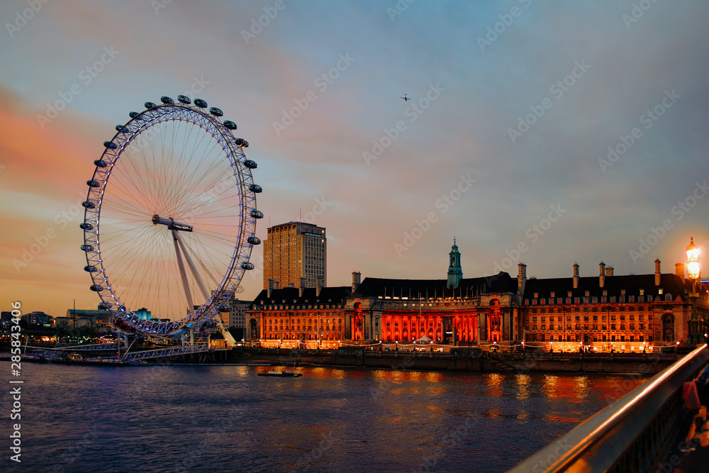 London Eye Ferris Wheel and County Hall in London dusk - obrazy, fototapety, plakaty 