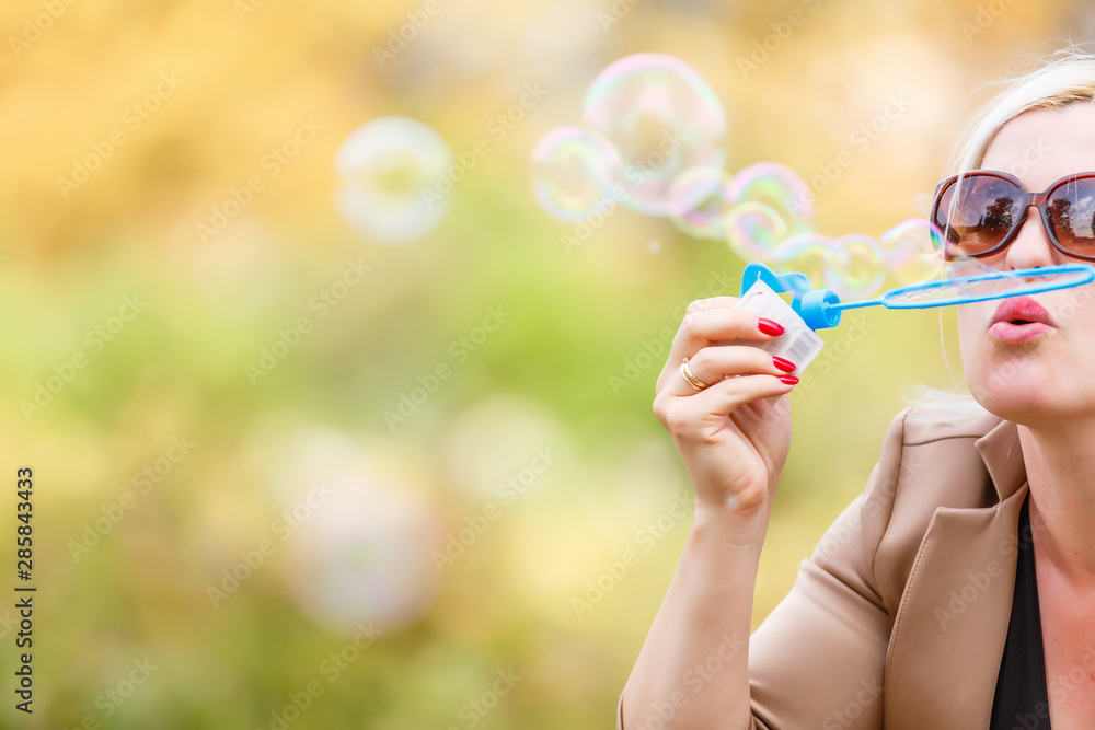 attractive young girl with soap-bubbles in beautiful yellow sunshine attractive young girl with soap-bubbles in beautiful yellow sunshine