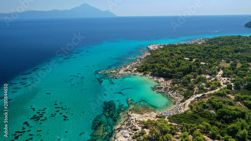 Aerial drone photo of iconic turquoise paradise rocky beach of Kavourotripes in Sithonia Peninsula, Halkidiki, North Greece © aerial-drone