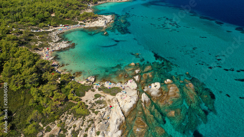 Aerial drone photo of iconic turquoise paradise rocky beach of Kavourotripes in Sithonia Peninsula, Halkidiki, North Greece