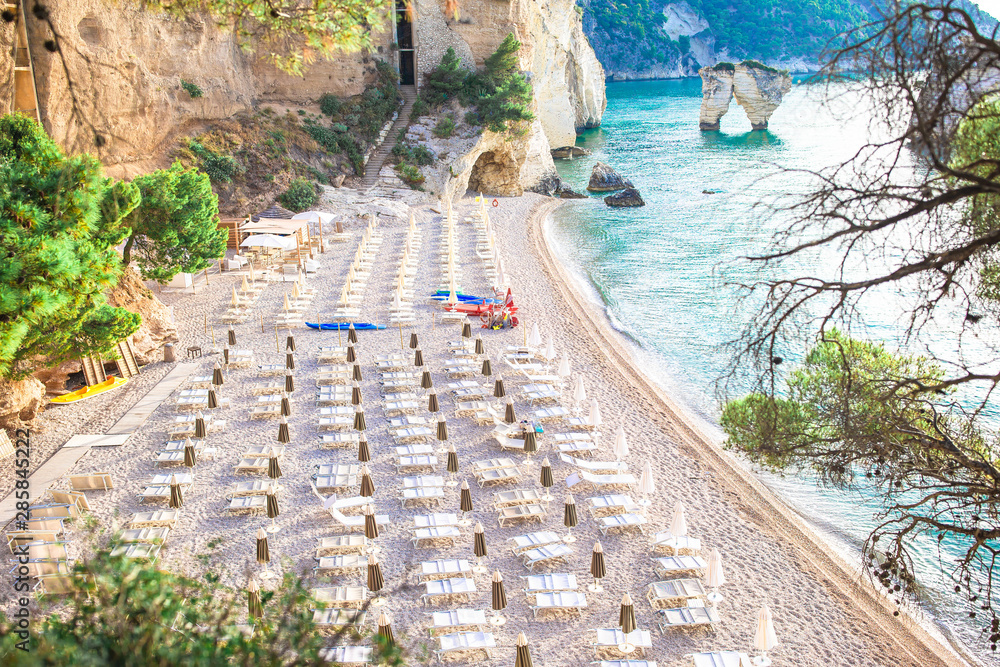 Fototapeta premium Mattinata Faraglioni stacks and beach coast of Mergoli, Vieste Gargano, Apulia, Italy.