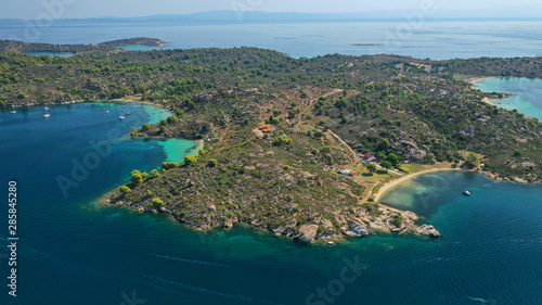 Aerial drone panoramic photo of iconic exotic bay known as blue lagoon in Diaporos island with turquoise clear sea, Vourvourou, Sithonia Peninsula, Halkidiki, North Greece © aerial-drone