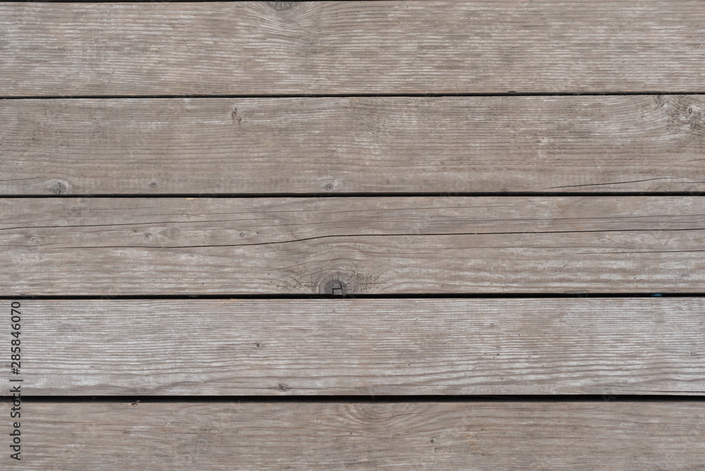 Old grey barn wall wood background texture close up Old grey barn wall wood background texture close up