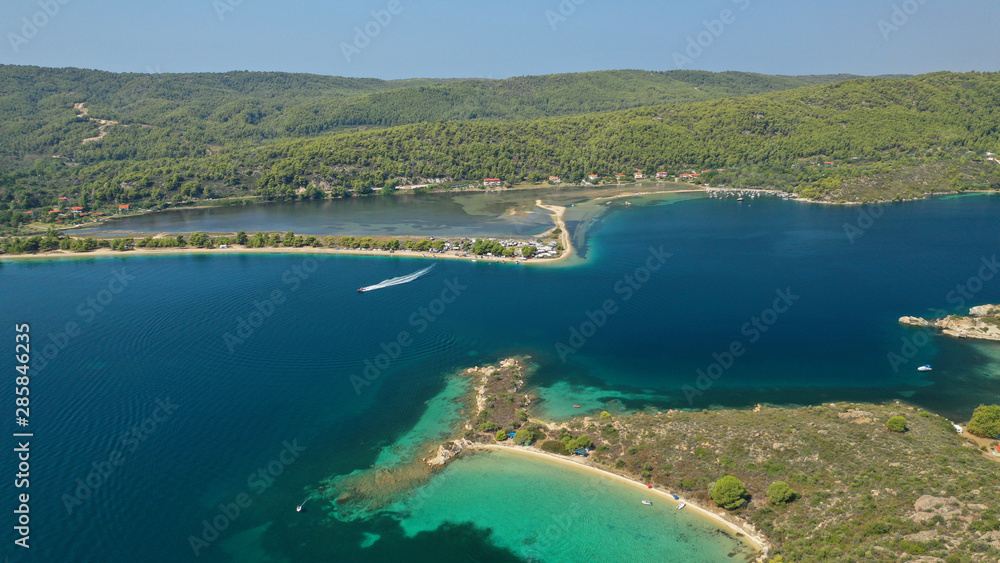 Aerial drone view of iconic Livari beach in natural exotic bay of Vourvourou, Sithonia peninsula, Halkidiki, Greece