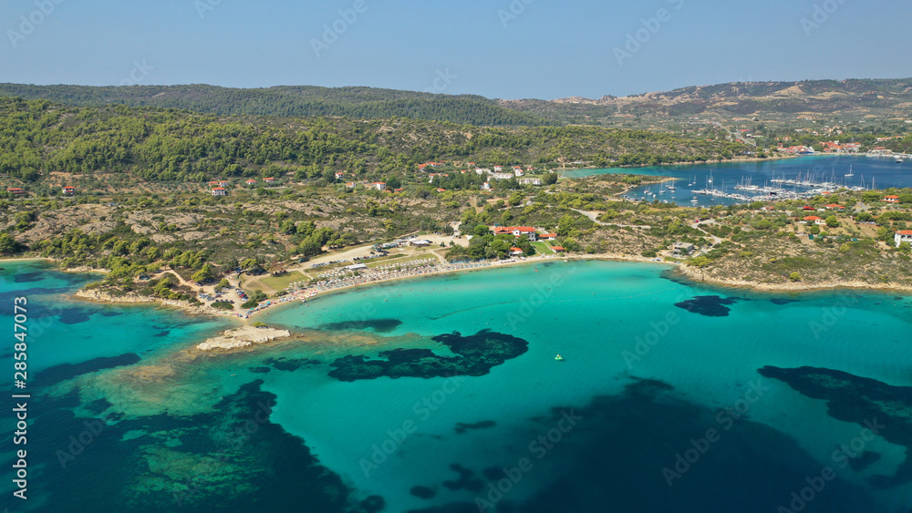 Aerial drone photo of turquoise bay near famous Vourvourou and Diaporos island, Sithonia peninsula, Halkidiki, North Greece