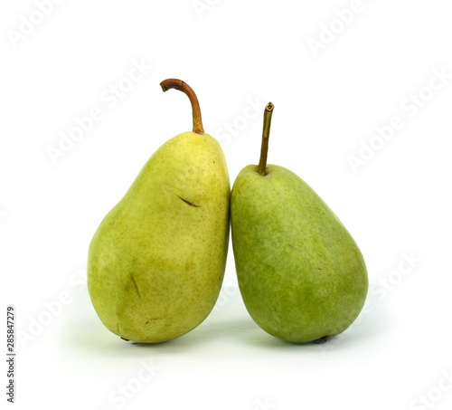 Green organic pears on white background