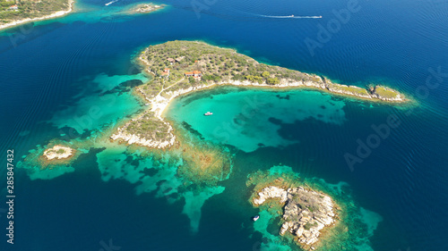 Aerial drone photo of turquoise bay near famous Vourvourou and Diaporos island, Sithonia peninsula, Halkidiki, North Greece © aerial-drone