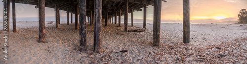 Wide Angle Panoramia of Wooden Post Under Long Pier