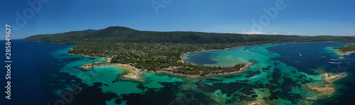 Aerial drone panoramic photo of iconic bay with turquoise frozen waves of Vourvourou in Sithonia Peninsula  Halkidiki  North Greece
