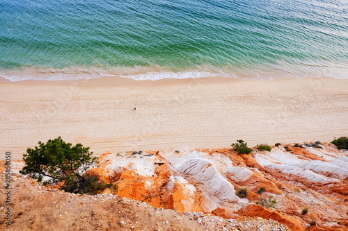 Aerial view on the beach Praia da Falesia Barranco das Belharucas. Region Faro, Algarve, Portugal. photo