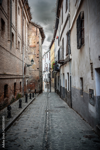 details of street in albaicin, granada, view of a narrow street in albaicin, the arab quarter in granada. spain © marinzolich