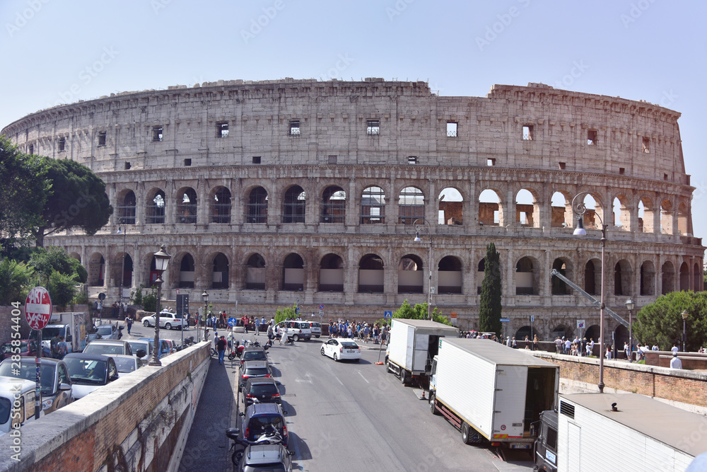 Rome, Italy - June 2019 -  Colosseum in Rome. Colosseum is the most landmark in Rome. Huge Roman amphitheatre.