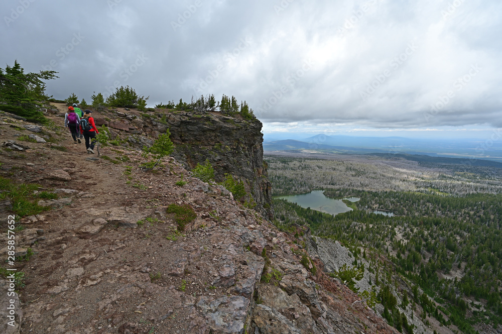 Hikers on the Tam McArthur Rim Trail in the Three Sisters vWilderness near Sisters, Oregon.