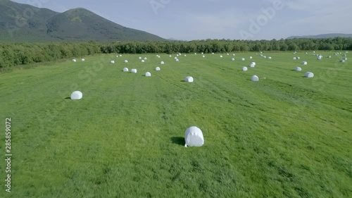 Drone  conducts  video shooting on agricultural fields where I harvest hay.