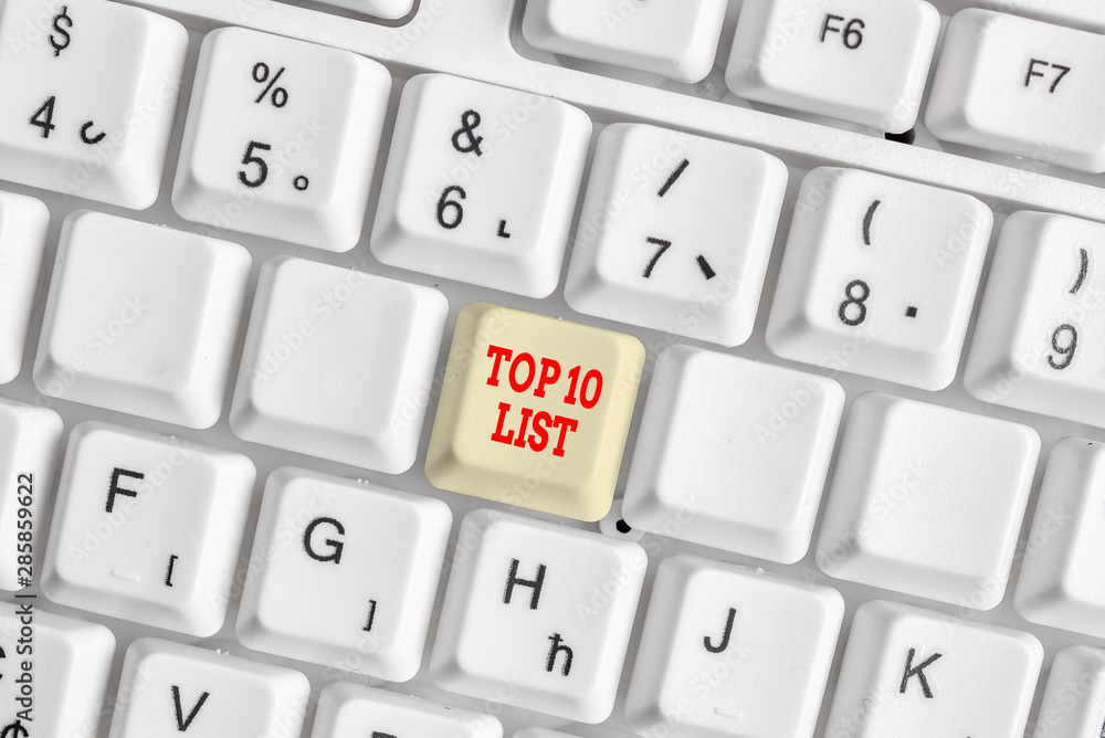 Conceptual hand writing showing Top 10 List. Concept meaning the ten most important or successful items in a particular list White pc keyboard with note paper above the white background Conceptual hand writing showing Top 10 List. Concept meaning the ten most important or successful items in a particular list White pc keyboard with note paper above the white background
