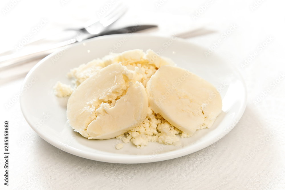 cheese on plate on white background