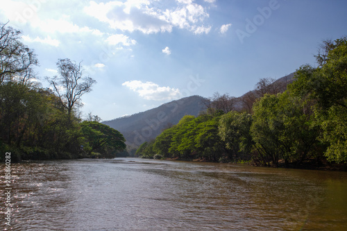 Beautiful scenery with river , forest mountain and blue sky © Parichat