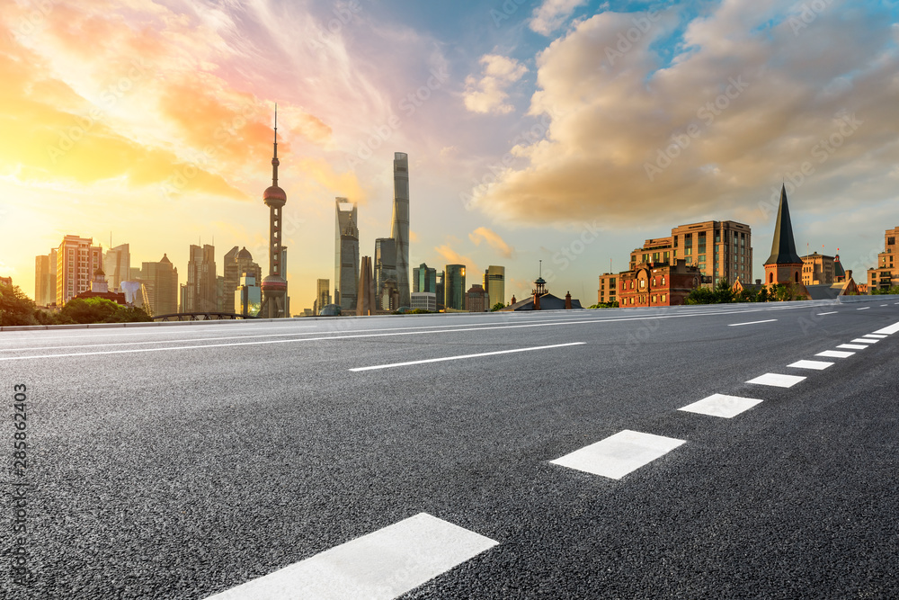 Empty highway and beautiful city buildings scenery at sunrise in Shanghai,China. - obrazy, fototapety, plakaty 