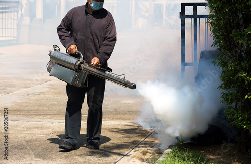 man using smoke machine for Desinsection and pest control
