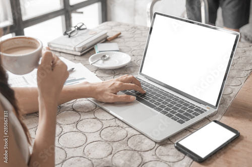 Mockup image of close up business woman working with smartphone laptop and documents in office, mockup concept