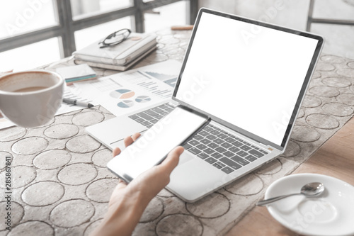 Mockup image of close up business woman working with smartphone laptop and documents in office, mockup concept