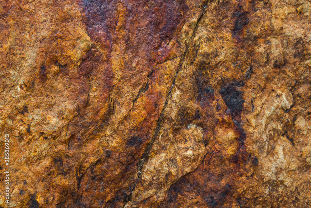Texture of natural stone, rough background. Shades of red and brown. Texture of natural stone, rough background. Shades of red and brown.