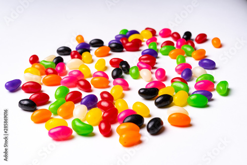 colorful jelly beans candies white background Top view © Liran