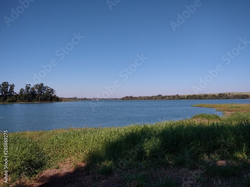 landscape with lake and blue sky