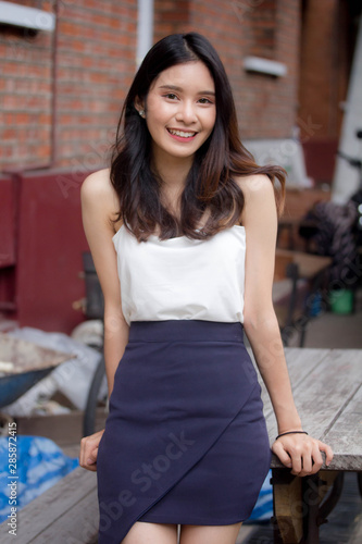 Portrait of thai china adult beautiful girl White shirt relax and smile
