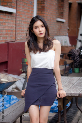 Portrait of thai china adult beautiful girl White shirt relax and smile