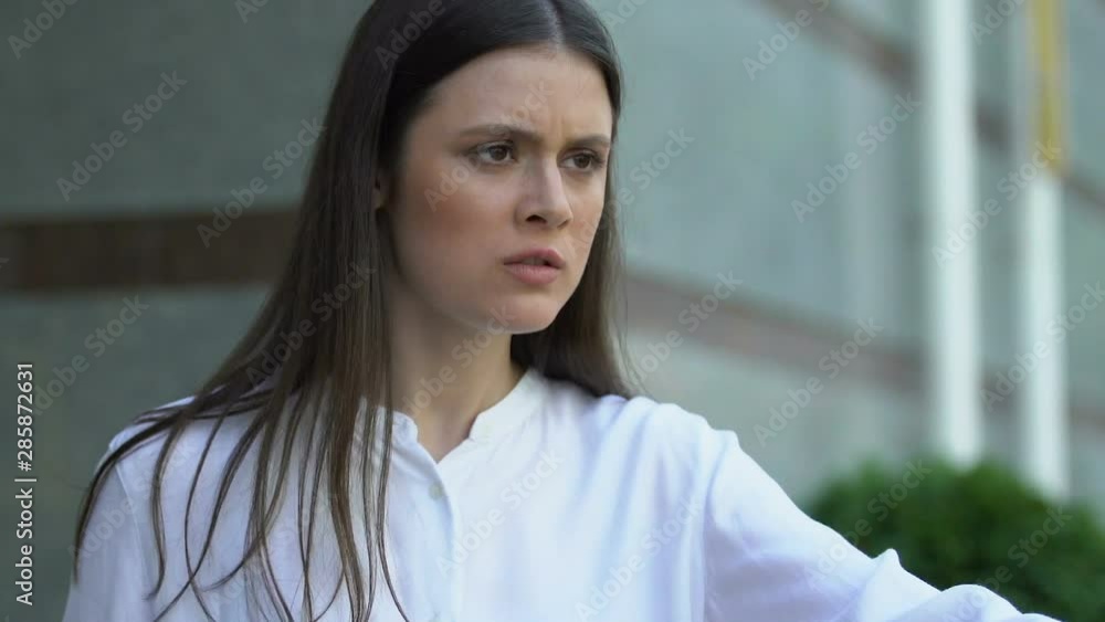 Irritated female director refusing to give journalist comments, mass media