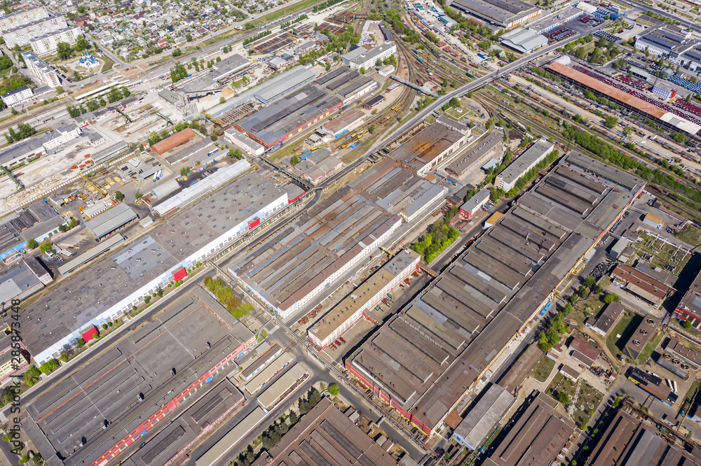 rows of industrial buildings and warehouses. birds eye view of city industrial area
